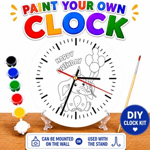 May include: DIY clock kit with a white clock face featuring a cartoon elephant holding balloons and the words "Happy Birthday." The kit includes paint pots in various colors, a paintbrush, and a stand. The clock can be mounted on the wall.