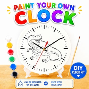 May include: DIY clock kit with a dinosaur design. The white clock face features a black and white dinosaur illustration, black clock hands, and a red second hand. Includes paint pots, a paintbrush, and a stand. The text on the clock says "PAINT YOUR OWN CLOCK".