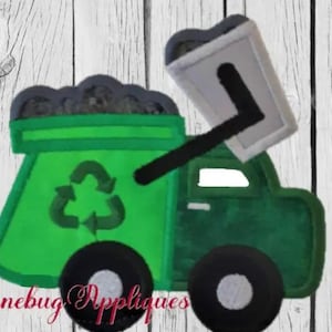 May include: Green recycling truck with a gray bin and a recycle symbol on the side. The truck has black wheels and a white background.
