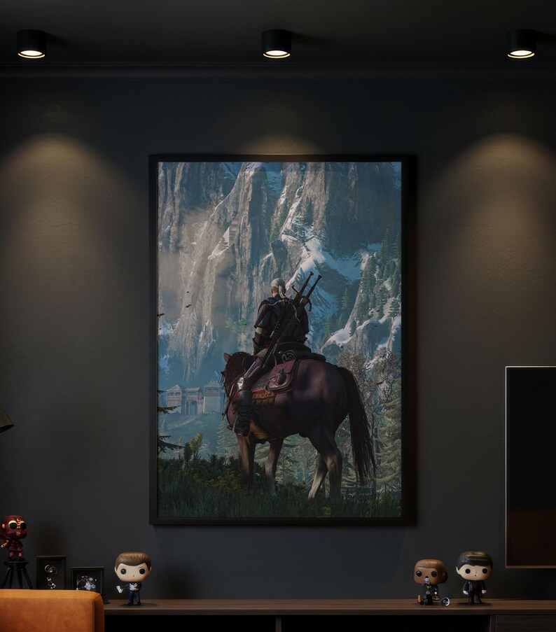 May include: A framed vertical wall art print depicting a figure with long white hair riding a brown horse, viewed from behind. The rider carries two swords on their back, facing a large stone fortress nestled against towering, snow-capped mountains.