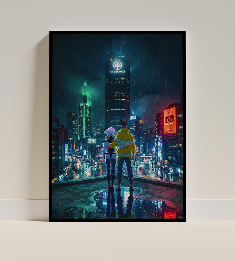 May include: A framed art print depicting a futuristic cityscape at night. Two figures stand on a rooftop, overlooking the neon-lit buildings. The print features the text "Arasaka" on a skyscraper and a rainy atmosphere.