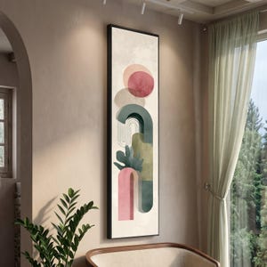 Könnte beinhalten: Abstrakter Kunstdruck in einem schwarzen Rahmen. Das Kunstwerk zeigt geometrische Formen in Rosa-, Grün- und Beigetönen. Ein großer roter Kreis und ein rosa Bogen sind prominent. Das Design hat eine moderne, minimalistische Ästhetik.