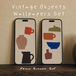 May include: Two smartphones displaying digital wallpapers with the text "Vintage Objects Wallpapers Set" and "Home Screen Set". The screens feature illustrations of mugs, vases, bowls, and pitchers in red, brown, olive green, blue, and dark gray.