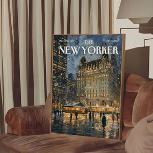 May include: A framed print of a New Yorker magazine cover from December 12, 1953, featuring a nighttime cityscape with a large building and figures. The print is displayed on a brown velvet sofa.