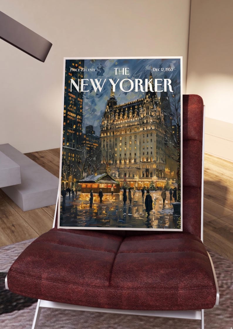 May include: A framed vintage cover of The New Yorker magazine, dated December 12, 1953, depicting a nighttime scene of a building with lights and people. The magazine is displayed on a burgundy chair.