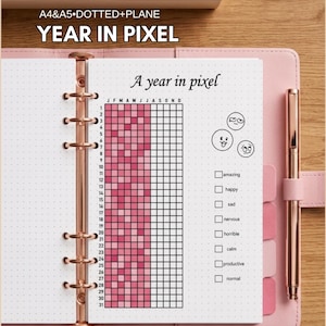 May include: A light pink ring-bound planner featuring a Year in Pixel mood tracker page with a grid of squares, a legend with emoji icons, and text including SUMMER SALE 40% OFF, A4&A5 DOTTED+PLANE, YEAR IN PIXEL, and A year in pixel.