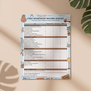 May include: A printed First Apartment Moving Budget planner sheet with sections for upfront costs, packing, logistics, essentials, and furniture. The document features light blue and brown accents, small illustrations, and blank columns for tracking estimated and actual expenses.