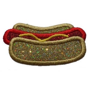 May include: A glittery gold hot dog with red relish and yellow mustard. The hot dog is a felt applique.