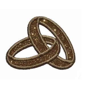 Puede incluir: Dos anillos de color dorado entrelazados, creando un símbolo de amor y compromiso. Los anillos están hechos de un material brillante con una superficie texturizada.