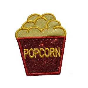 May include: Red and yellow embroidered iron-on patch with the word "POPCORN" in yellow letters and a depiction of popcorn in a red bucket.