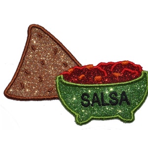 May include: A green bowl filled with red salsa and the word "SALSA" written in black. A brown tortilla chip is next to the bowl.