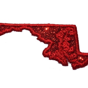 May include: Red glitter outline of the state of Maryland. The glitter is very sparkly and the outline is a bit fuzzy.