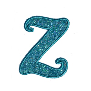 May include: A turquoise blue glitter letter Z with a cursive font style.