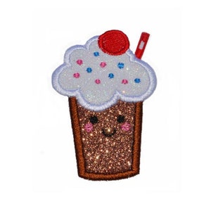 May include: A glittery brown ice cream cup with a smiling face, topped with white whipped cream, a red cherry, and a red straw. The whipped cream has pink and blue sprinkles. The edges are outlined in brown.