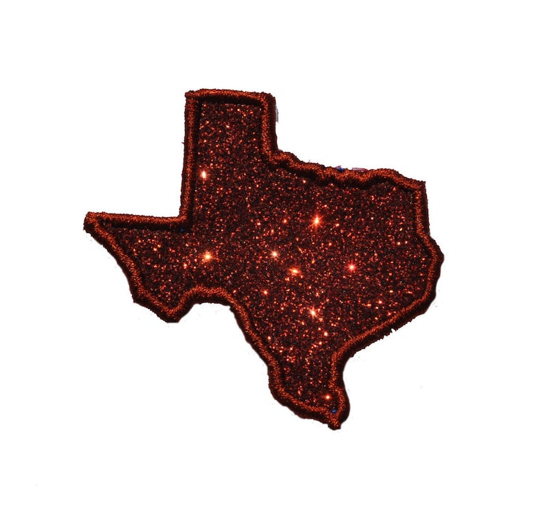 Pu&ograve; includere: Un contorno scintillante dello stato del Texas in glitter marrone.
