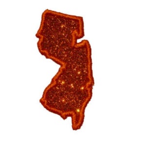 May include: A patch shaped like the state of New Jersey, featuring a vibrant orange glitter finish throughout the entire surface. The edges are defined by a thick, stitched border in a matching orange thread, creating a distinct outline.
