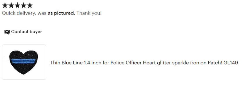 May include: A black heart-shaped iron-on patch with a thin blue line across the center. The patch is 1.4 inches in size and features glitter sparkle. The text "Thin Blue Line 1.4 inch for Police Officer Heart glitter sparkle iron on Patch! GL149" is visible below the patch.