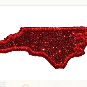 May include: Red glitter outline of the state of North Carolina.