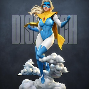 May include: A superheroine figurine in a dynamic pose, wearing a blue and white bodysuit with a yellow cape and mask. The figure has blonde hair and is standing on a cloud base. The word "DISPATCH" is in the background.