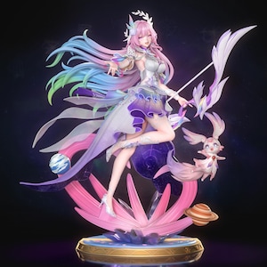 May include: A detailed figurine of a female character with pink hair and a flowing dress in shades of purple, blue, and white. She holds a bow and arrow, with a small, winged creature nearby. The base is adorned with pink and gold accents.