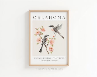May include: A framed wall art print featuring two scissor-tailed flycatchers perched on a branch with pink flowers. The text reads OKLAHOMA, SCISSOR-TAILED FLYCATCHERS, The State Birds Collection, and THE STATE POPPY PRINTS in a neutral color palette.