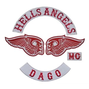 May include: A set of embroidered patches featuring the words "HELLS ANGELS" in red on a white arched background. Includes two red and white winged skull patches, a small "MG" patch, and a "DAGO" patch.