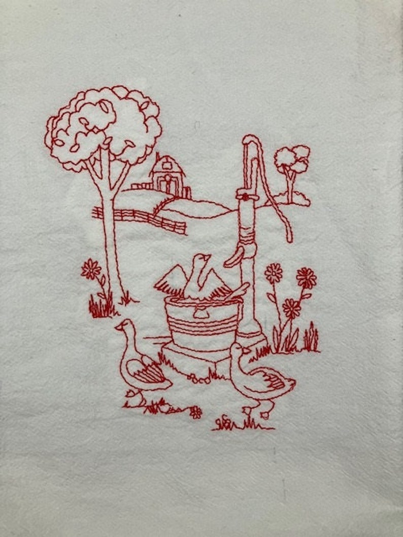 May include: Red embroidered design on a white fabric background. The design features a well with a bucket, a tree, a house, and three ducks. The ducks are near the well and the house is in the background.