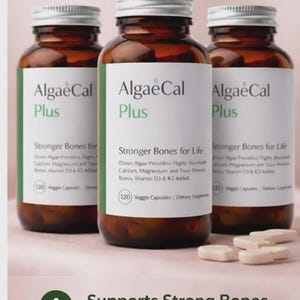 May include: Three brown supplement bottles labeled "AlgaeCal Plus" with text indicating support for strong bones. The bottles are displayed with the text "Pack of 3" above them. The labels also state the product includes D3 + K2, and Magnesium.