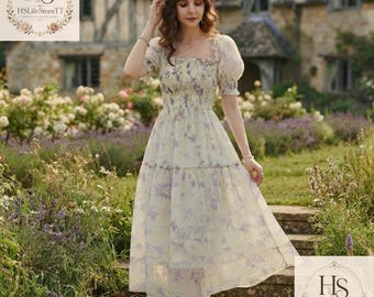Abito midi primaverile da donna con stampa floreale in stile cottagecore e maniche a sbuffo.
