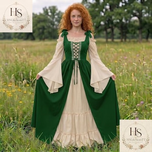 May include: A floor-length dress featuring a dark green bodice with a lace-up front and long, flared beige sleeves. The skirt is layered with a dark green overskirt and a beige underskirt with a ruffled hem. The garment has shoulder ties.