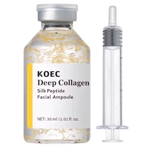May include: A clear glass bottle of KOEC Deep Collagen facial ampoule with a silver cap and a yellow label. The bottle contains a clear liquid with strands of a yellow substance. A clear syringe is next to the bottle. The label reads "Silk Peptide Facial Ampoule".