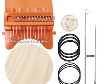 May include: An orange metal darning loom with silver hooks, a round light wood disc, a small circular wooden piece with a floral engraving, three black elastic bands, and two long silver metal needles for textile repair and weaving projects.