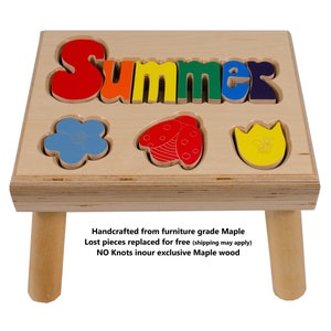 May include: A wooden stool with a cutout puzzle featuring the word "Summer" in rainbow colors. The puzzle also includes a flower, a ladybug, and a tulip with a bee. The stool is handcrafted from furniture grade maple wood.