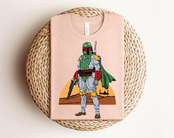 Camiseta de Boba Fett de Star Wars, camiseta gráfica galáctica de cazarrecompensas, top del universo mandaloriano en verde salvia jaspeado, regalo retro para fans de la ciencia ficción