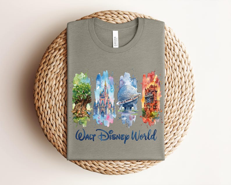 May include: A gray t-shirt featuring watercolor illustrations of iconic Walt Disney World landmarks: the Tree of Life, Cinderella Castle, Spaceship Earth, and the Tower of Terror. The words "Walt Disney World" are written in a blue script font below the illustrations.