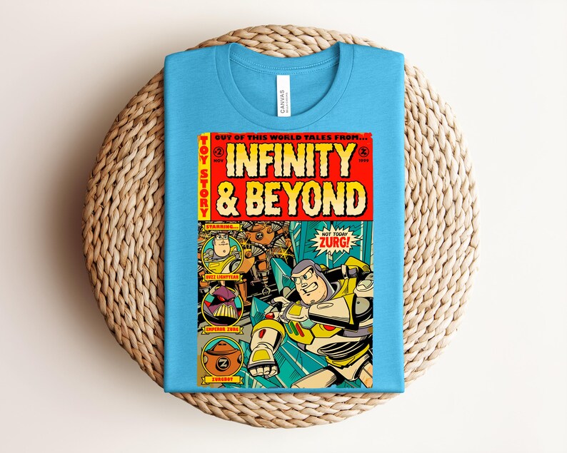 Puede incluir: Una camiseta azul claro con un gr&aacute;fico de portada de c&oacute;mic titulado Infinity & Beyond. El dise&ntilde;o incluye los personajes Buzz Lightyear, Emperor Zurg y Zurgbot con el texto Out of this world tales from, Toy Story y Not today Zurg!