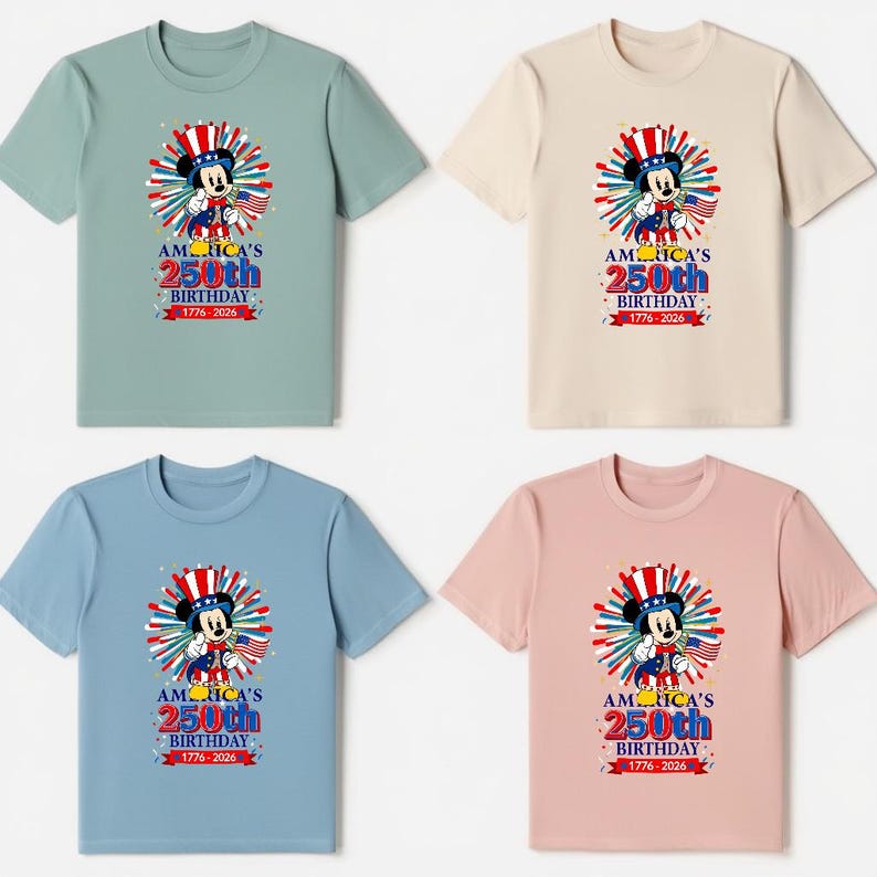 May include: Four t-shirts in different colors: green, beige, blue, and pink. Each shirt features a graphic of a cartoon mouse wearing a patriotic hat and holding a flag. The text on the shirts reads "America's 250th Birthday 1776-2026."