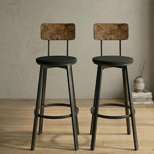 May include: Two industrial-style bar stools. Each stool has a black metal frame, a round black seat, and a rectangular backrest made of distressed wood. The stools are set against a neutral background, suggesting a modern or rustic aesthetic.