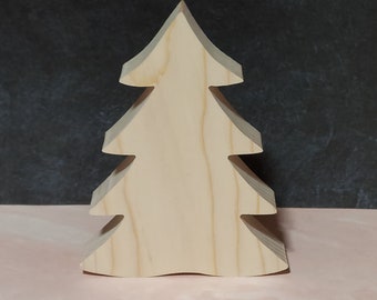May include: A wooden Christmas tree cutout, unpainted, with a simple design. The tree is made of light wood and has a smooth surface.