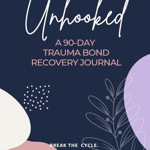 May include: A navy blue journal cover with the word "Unhooked" in white script. The text "A 90-DAY TRAUMA BOND RECOVERY JOURNAL" is below. Additional text reads "BREAK THE CYCLE. REGULATE YOUR NERVOUS SYSTEM. REBUILD YOURSELF."