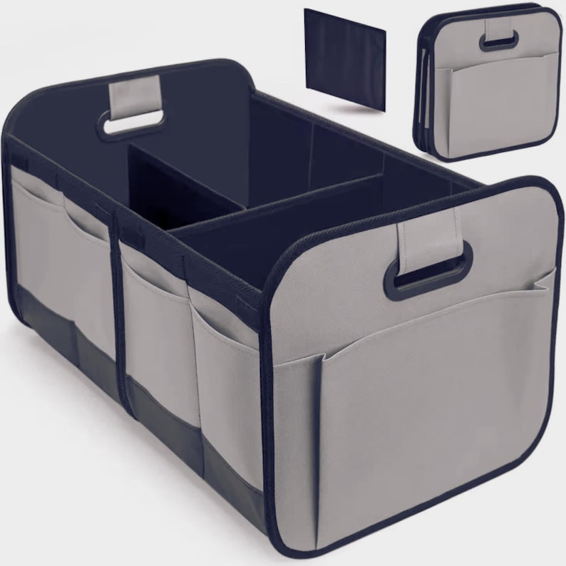 May include: A grey and navy blue car organiser with multiple compartments and external pockets. The organiser has handles for easy carrying and is designed to keep items secure and organised. Includes a separate, foldable panel.