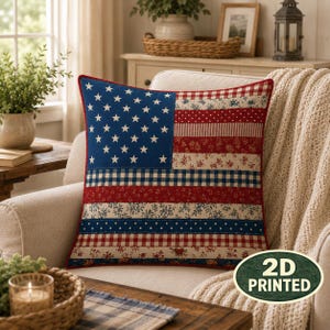 May include: A square throw pillow featuring a patchwork design of the American flag. The left section is a blue field with white stars, while the right section consists of horizontal stripes in red, white, and blue with floral, plaid, and polka dot patterns.