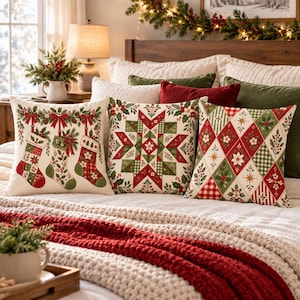 May include: Three square throw pillows featuring festive holiday designs. One pillow displays three hanging Christmas stockings with pine branches. Another shows a central star pattern. The third features a diamond grid with poinsettias.