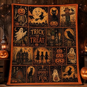 May include: A rectangular Halloween-themed quilt featuring a grid of illustrations including a skeleton, a witch on a broom, a black cat, a scarecrow, ghosts, a haunted house, and pumpkins. The text reads TRICK OR TREAT and A LITTLE SPOOKY A LOT OF FUN.
