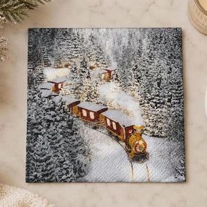 May include: A square paper napkin featuring a detailed illustration of a vintage steam train traveling through a snow-covered forest. The train is red and gold, emitting white smoke, and is surrounded by dense evergreen trees dusted with snow.
