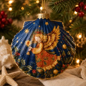 May include: A scallop shell Christmas ornament featuring a deep blue background with a painted angel holding a star. The angel has golden wings and a patterned red and gold dress. The shell is decorated with gold stars, holly, and berries.