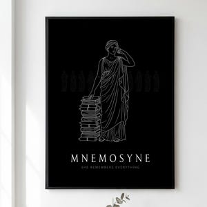 May include: A framed wall art print featuring a black background with a white line drawing of a figure in classical robes standing beside a stack of books. The text MNEMOSYNE and SHE REMEMBERS EVERYTHING is printed in white at the bottom of the print.