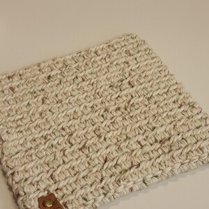 Oatmeal color with flecks of brown and green