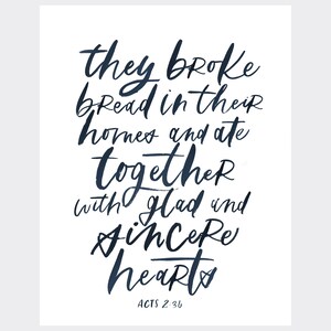 May include: A watercolor-style image with a navy blue quote that reads "they broke bread in their homes and ate together with glad and sincere hearts ACTS 2:36".