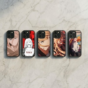 May include: Five black phone cases with anime-style character art. The cases feature different characters with varying hair colors and styles. One case has the word "POWER" on a white shirt. The cases are arranged in a row on a marble surface.